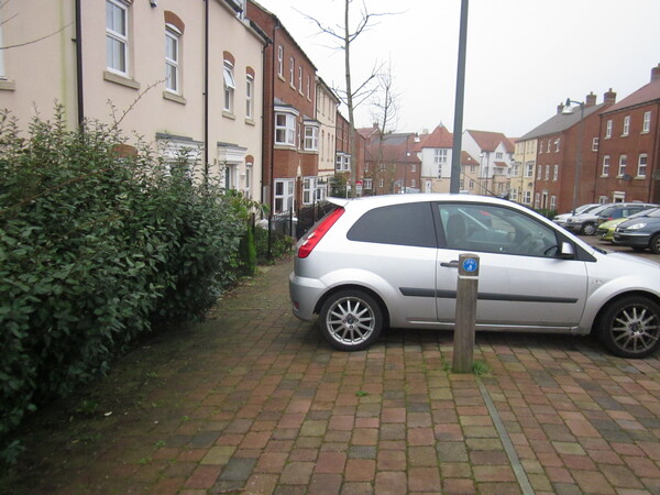 The photo for Cars parked over shared cycle / footpath near Bluebell Road, Orchid Court, and Poppy Mead.